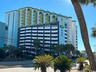 Oceanfront resort building with parking and palm trees at 6804 N Ocean Blvd. # 1527, Myrtle Beach, SC 29572