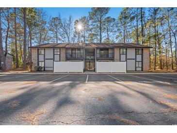 Brick condo building with parking and wooded area at 950 Forestbrook Rd. # D3, Myrtle Beach, SC 29579