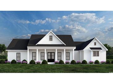 White farmhouse exterior with black roof, covered porch, and landscaping at 2184 Pettus Way, Surfside Beach, SC 29575