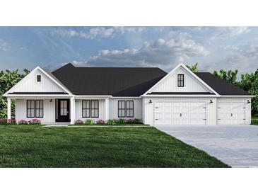 White farmhouse exterior with a black roof, two-car garage, and landscaping at 2180 Pettus Way, Surfside Beach, SC 29575