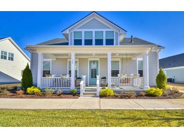 Gray two-story house with a front porch and landscaped yard at 150 Black Water Dr., Murrells Inlet, SC 29576