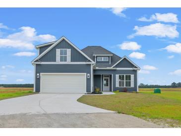 Two-story house with gray siding, white trim, and a two-car garage at 216 William Nobles Rd., Aynor, SC 29511