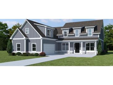 Two-story farmhouse style home with gray siding, white trim, and a large front yard at 364 Ridge Dr., Galivants Ferry, SC 29544