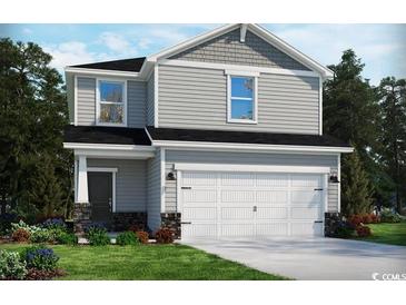 Two-story home with gray siding, white garage door, and stone accents at 4807 Hopespring St., Myrtle Beach, SC 29579