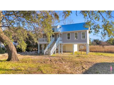 Elevated coastal cottage with metal roof and spacious deck at Tbd Park St., Georgetown, SC 29440