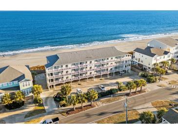 Oceanfront property with beach access, parking, and nearby houses at 1317 S Ocean Blvd. # 306, Surfside Beach, SC 29575