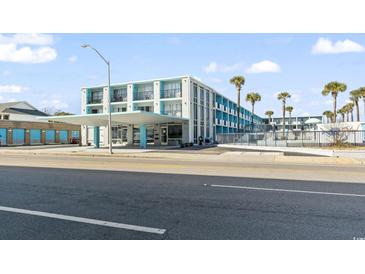 Wave Rider Oceanfront Hotel, featuring a retro-style building with a pool and ample parking at 1600 S Ocean Blvd. # 312, Myrtle Beach, SC 29577