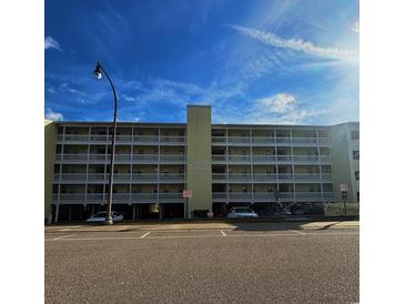 Building exterior of Windy Shores II, featuring parking and signage at 3217 S Ocean Blvd. S, North Myrtle Beach, SC 29582