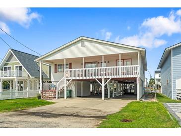Elevated beach home with spacious deck and parking underneath at 327 55Th Ave. N, North Myrtle Beach, SC 29582