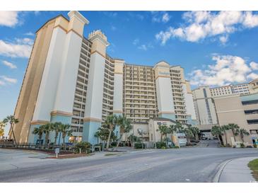 Oceanfront high-rise building with parking and tropical landscaping at 4800 S Ocean Blvd. # 1007, North Myrtle Beach, SC 29582