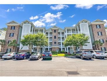 Brick building exterior with parking and landscaping at 4882 Luster Leaf Circle # 202, Myrtle Beach, SC 29577