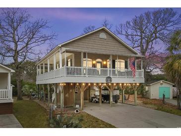 Elevated beach home with large deck and parking underneath at 6001 - 7032 S Kings Hwy., Myrtle Beach, SC 29575