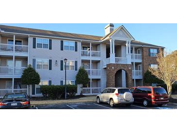 Three-story apartment building with brick accents and private balconies at 3795 Hitchcock Way # 617, Myrtle Beach, SC 29577