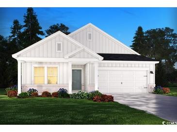 Charming single-story home with white siding, a two-car garage, and a well-manicured front lawn at 5028 Riverton Ct, Myrtle Beach, SC 29579