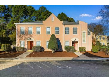 Attractive tri-level townhome with well-manicured landscaping at 4533 Girvan Dr. # D, Myrtle Beach, SC 29579