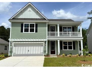 Charming two-story home with a covered front porch and a two car garage at 507 Slaty Dr., Myrtle Beach, SC 29588