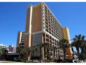 Oceanfront high-rise building with balconies and palm trees at 6900 N Ocean Blvd. # 111, Myrtle Beach, SC 29572