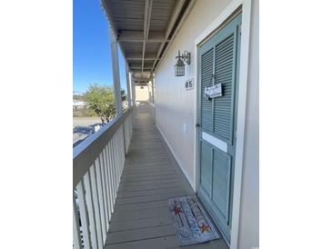 Two-story building with parking and balconies at 9661 Shore Dr. # 4B-15, Myrtle Beach, SC 29572