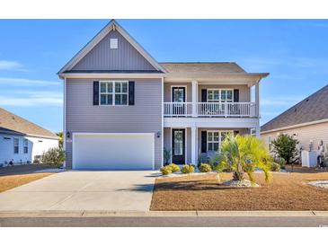 Two-story house with gray siding, white garage door, and landscaping at 1208 Maxwell Dr., Little River, SC 29566