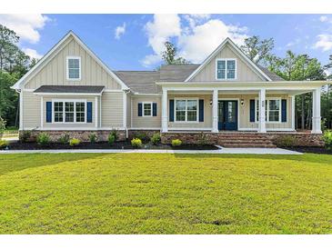 Charming single-Gathering home with a inviting front porch, manicured lawn and blue shutters at 3220 Highway 19, Conway, SC 29526