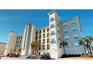 Elegant condo building with classic architecture, balconies, and well-maintained landscaping and ample parking at 257 Venice Way # H 204, Myrtle Beach, SC 29577