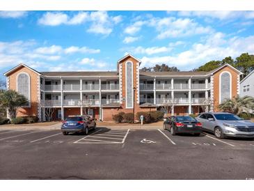 Inviting condo building with ample parking and landscaping at 4850 Meadowsweet Dr. # 1711, Myrtle Beach, SC 29579
