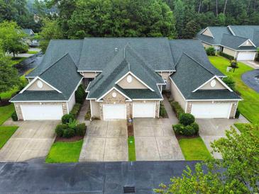 Attractive three-unit building with a green roof and two-car garages at 663 Pinehurst Dr. # 93C, Pawleys Island, SC 29585