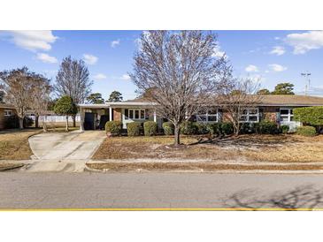 Brick ranch home with carport and mature landscaping at 673 Hemlock Ave., Myrtle Beach, SC 29577