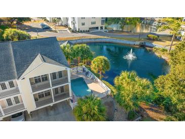 Aerial view of a beach town home with private pool and pond at 209 Hillside Dr. N # 204, North Myrtle Beach, SC 29582