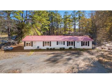 Aerial view of a ranch-style home with red roof at 45 Steve Carmichael Rd., Hemingway, SC 29554