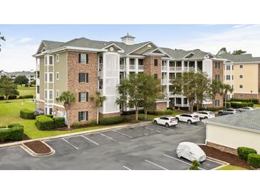 Brick building exterior with parking and landscaping at 4894 Luster Leaf Circle # 402, Myrtle Beach, SC 29577