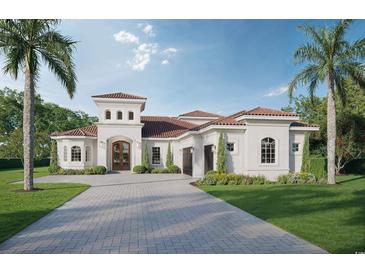 Stunning curb appeal! This home features a tile roof and a beautiful front yard at 9387 Venezia Circle, Myrtle Beach, SC 29579