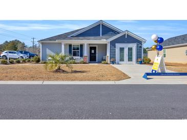 Dream Finders Home's exterior features gray and blue siding at 109 Foxford Dr., Conway, SC 29526