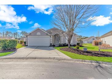 Attractive one-story home with a landscaped yard and attached garage at 113 Barn Owl Ct., Carolina Shores, NC 28467