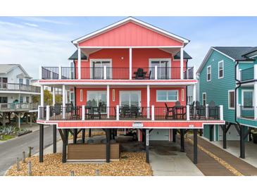 Two-story beach home with large decks and parking underneath at 6001 - E-10 S Kings Hwy., Myrtle Beach, SC 29575