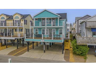 Two-story teal home with multiple balconies and ocean views at 6001 - E8 S Kings Hwy., Myrtle Beach, SC 29575