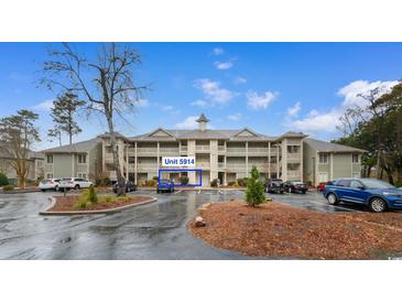 Exterior view of unit 5914, a condo building with ample parking at 1551 Spinnaker Dr. # 5914, North Myrtle Beach, SC 29582