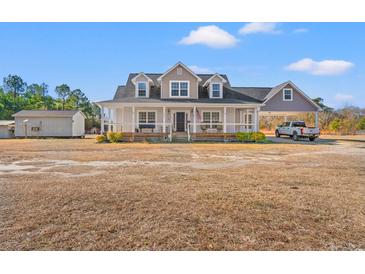 Two story house with attached carport and detached shed at 2024 Senator Gasque Rd., Marion, SC 29571