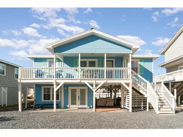 Charming blue beach cottage with wrap-around porch and elevated deck at 5607 N N Ocean Blvd., North Myrtle Beach, SC 29582