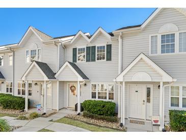 Charming townhome featuring a welcoming entrance and well-maintained landscaping at 618 3Rd Ave. S # 4D, North Myrtle Beach, SC 29582