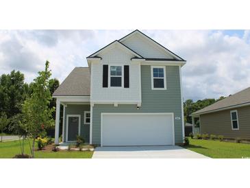 Two-story house with gray siding, white accents, and a two-car garage at 1137 Black Lake Way, Conway, SC 29526