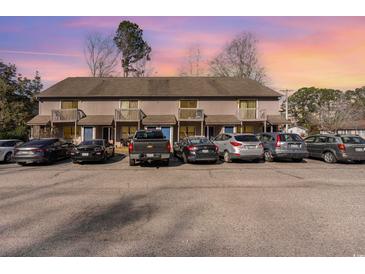 Front view of a multi-unit building with parking at 115 Horizon River Dr. # 8D, Myrtle Beach, SC 29588