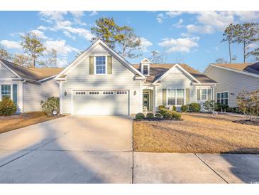 Two-story house with gray siding, two-car garage, and landscaped yard at 1536 Suncrest Dr., Myrtle Beach, SC 29577