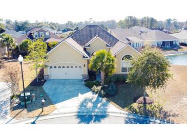 Attractive one-story home with a two-car garage and landscaped yard at 2117 Mirabel Ct., North Myrtle Beach, SC 29582