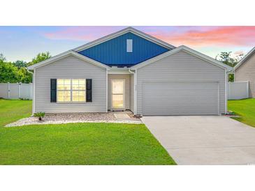 Newly built home with blue accents and a two-car garage at 352 High Falls Dr., Conway, SC 29526