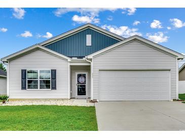 Charming single-Gathering home boasting a well-manicured lawn and an attached two-car garage at 352 High Falls Dr., Conway, SC 29526