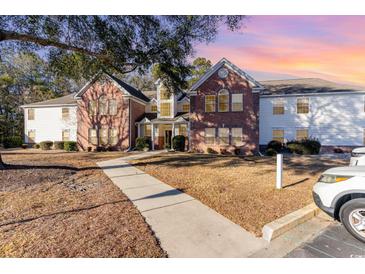 Brick building exterior with walkway and landscaping at 4384 Daphne Ln. # H, Murrells Inlet, SC 29576