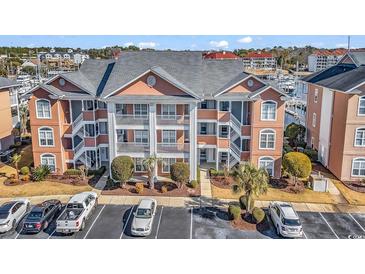 Attractive three-story building with parking and water views at 4625 Lightkeepers Way # 7-H, Little River, SC 29566