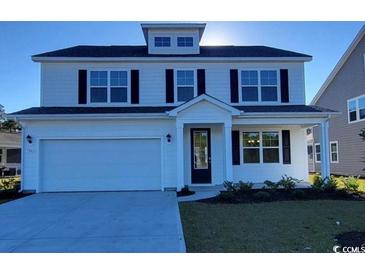 Two-story house with white siding, black windows, and a two-car garage at 715 Choctaw Dr., Conway, SC 29526