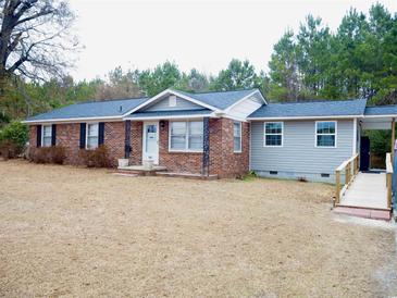 Ranch style home with brick and gray siding, landscaping, and a ramp at 187 Stephen Dr., Hemingway, SC 29554